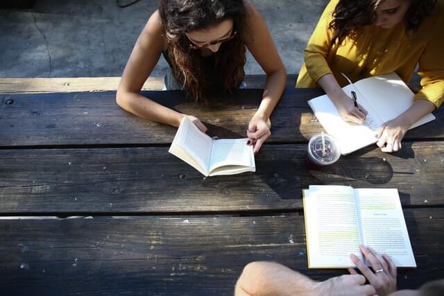 girls with social anxiety in college sitting down at a table