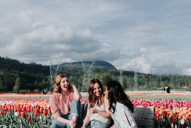 young adult women with social anxiety talking outside and smiling