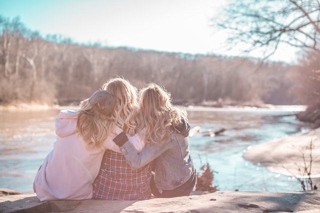 group of young adult women sitting down possibly talking about dating anxiety